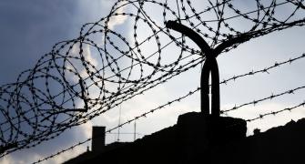 barbed wire on top of a fence, reflecting the theme of organised crime